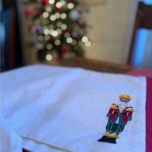 At Home 4 Christmas nutcracker placemats. 100% polyester. 13”X19” NWT.